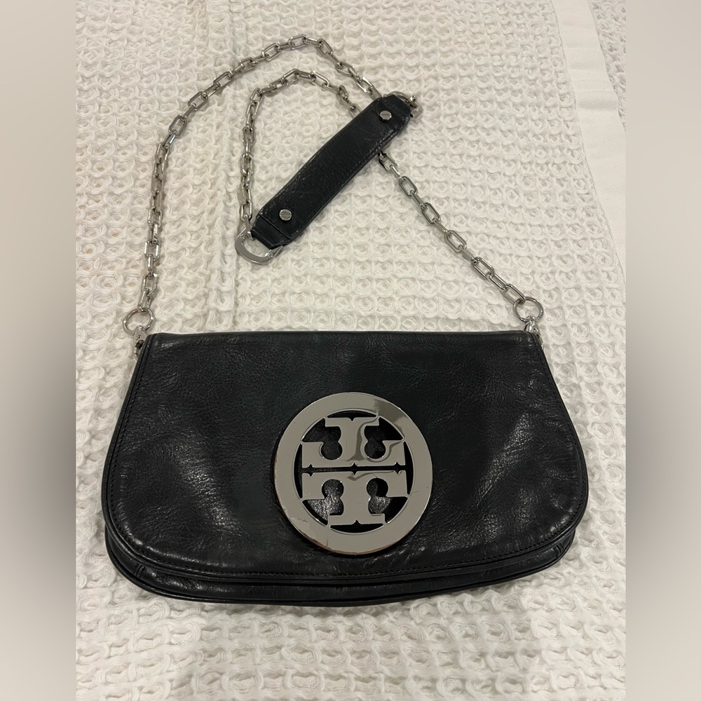 Tory Burch classic black purse than can be used as a clutch or shoulder bag.